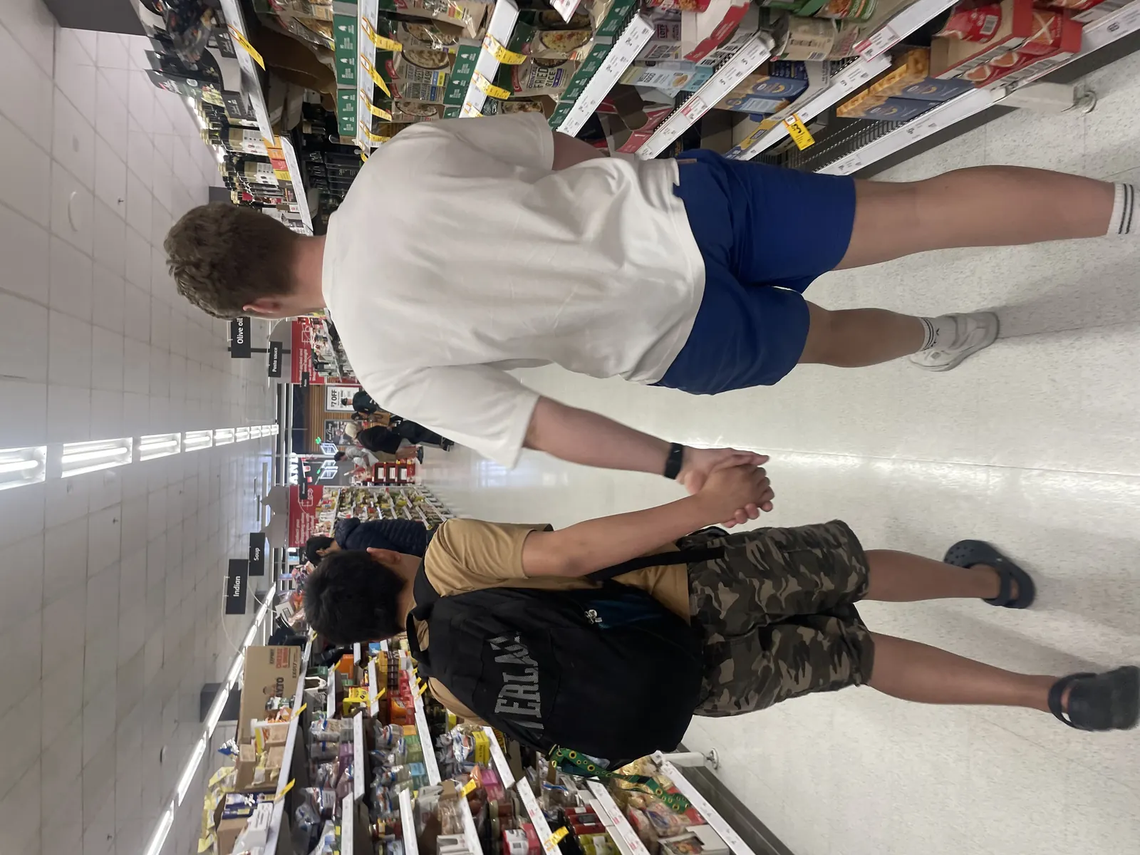 Support worker helping with an everyday shopping trip
